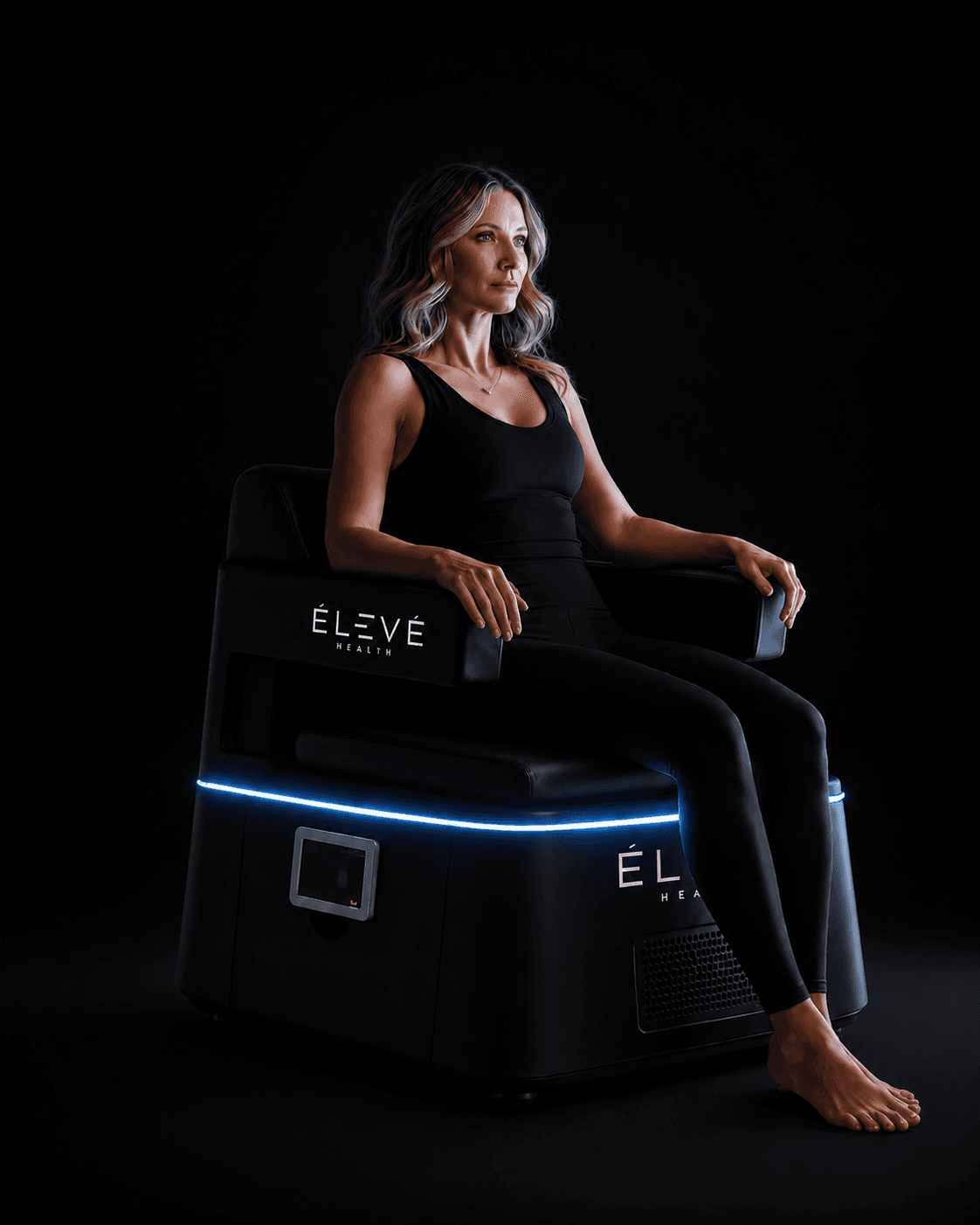 Woman seated in PEMF chair at Eleve Newport Beach